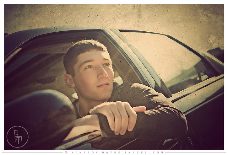 high school senior chilling with car