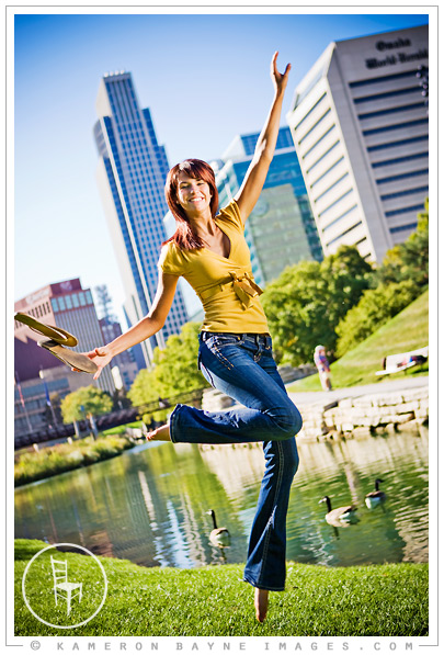 portrait of high school senior dancing in the air