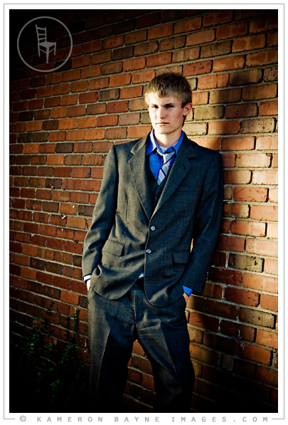 Kameron Bayne Images - Zach, Millard North Senior 2009 High school senior in business suit leaning against brick wall