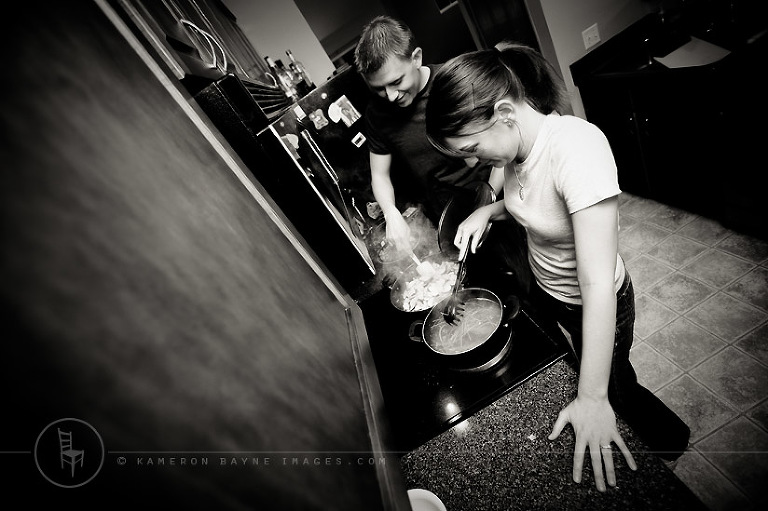 engagement couple cooking dinner together