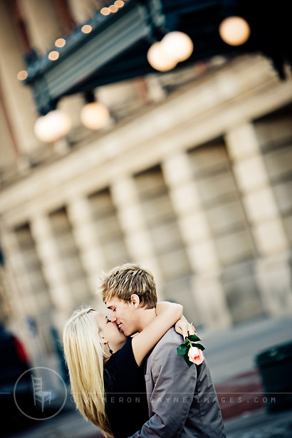 engagement picture of couple in romantic embrace; downtown Lincoln, the Haymarket