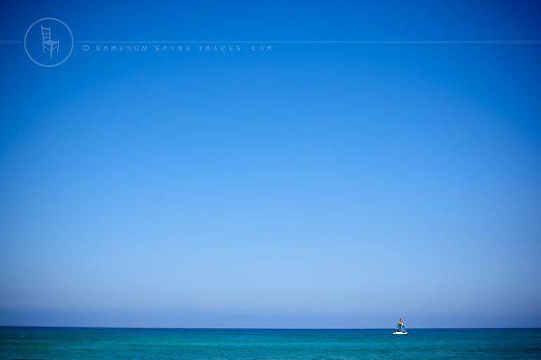 Kameron Bayne Images - Rainbow Sailboat in the Hawaiian Ocean