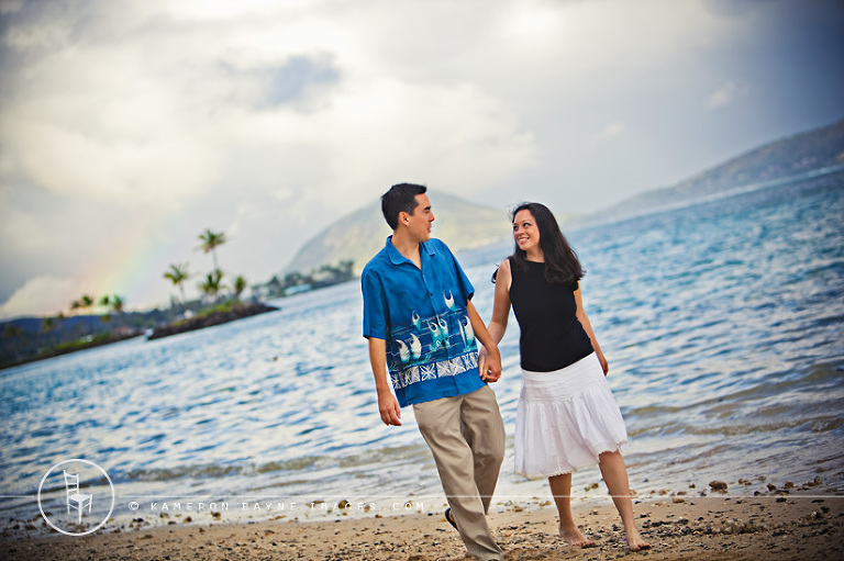 Kameron Bayne Images - Couple Walking on the Beach with Rainbow in the Distance