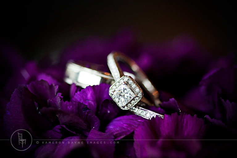 Kameron Bayne Images - Wedding Rings and Purple Flowers