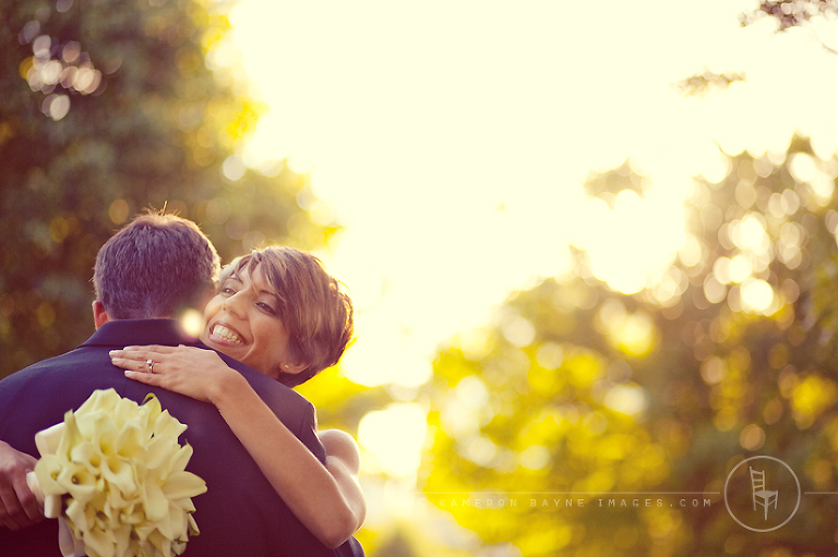 breathe taking moment just before sun down as she hugs her new husband