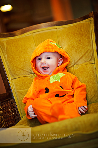 Dressed as a Pumpkin for Halloween makes a Baby happy
